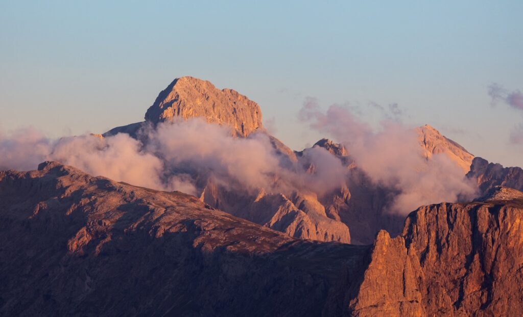 Jagged mountain peaks bathed in golden hour light
