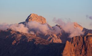 Jagged mountain peaks bathed in golden hour light