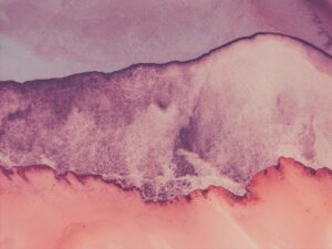 Abstract watercolor painting with pink and purple hues